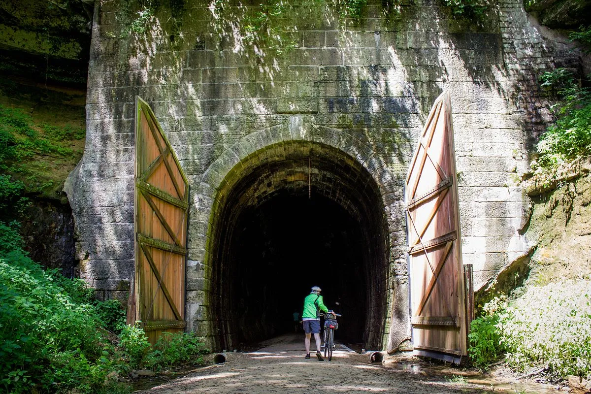 Man outside tunnel on Elroy-Sparta Trail