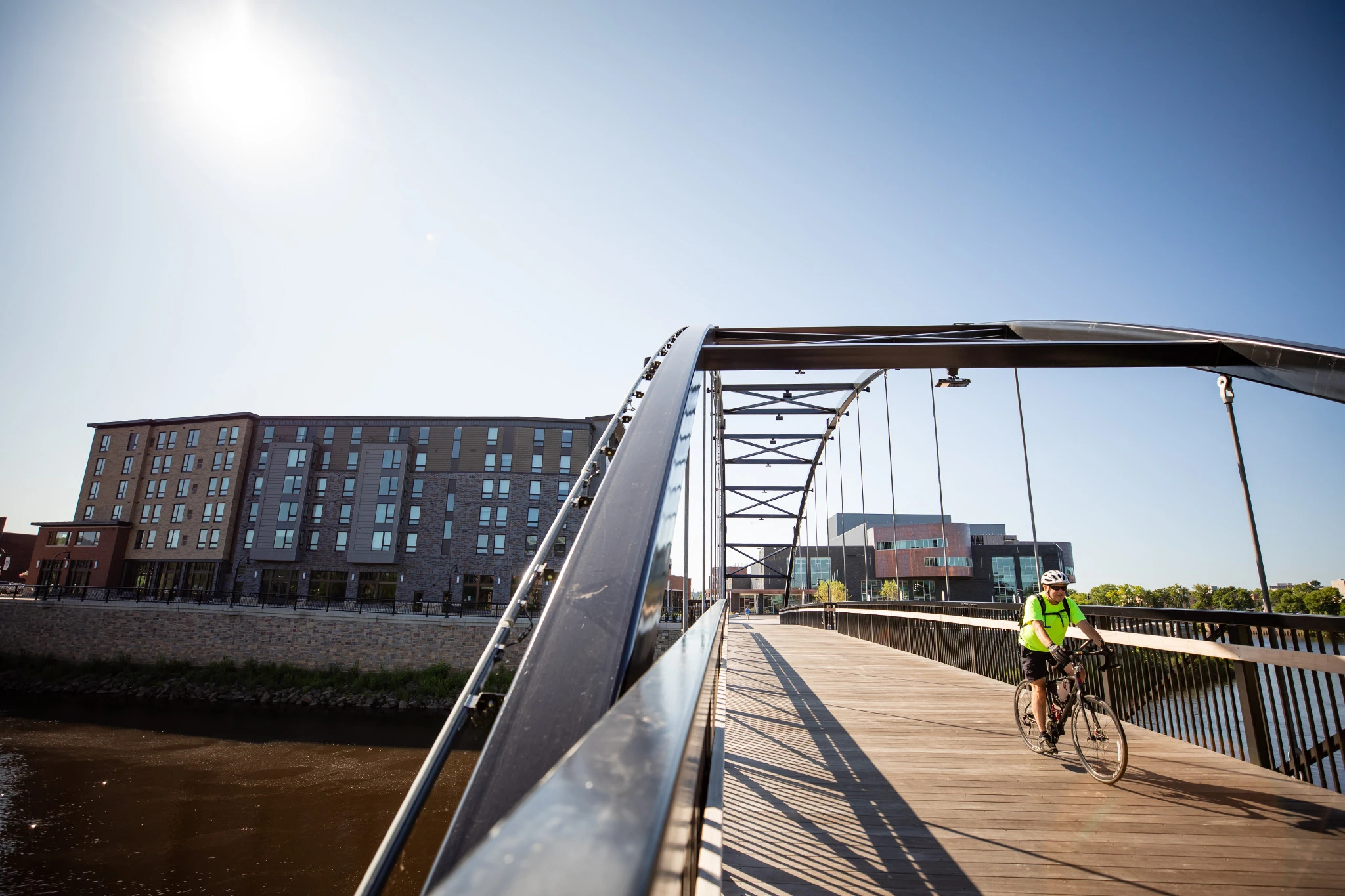 036 Guy Biking Over Bridge in Downtown Eau Claire